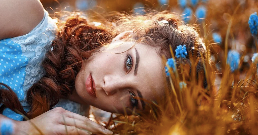 woman in field lying down