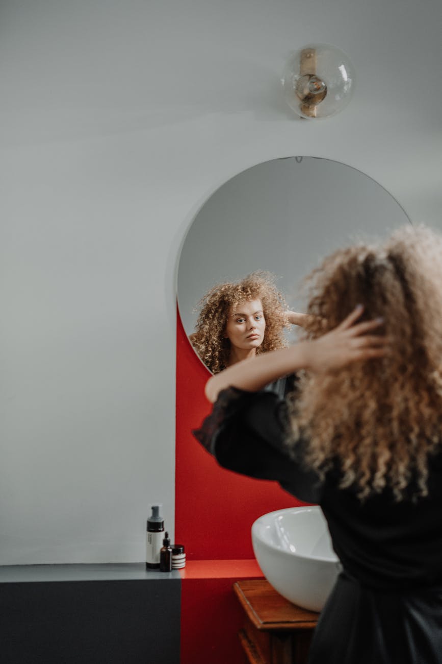 woman looking in the mirror